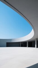 Fototapeta premium Modern Architectural Structure with Curved Overhang and Clear Sky