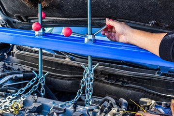 Engine support bar in use during motor mount replacement. Ideal for car repair tutorials,...