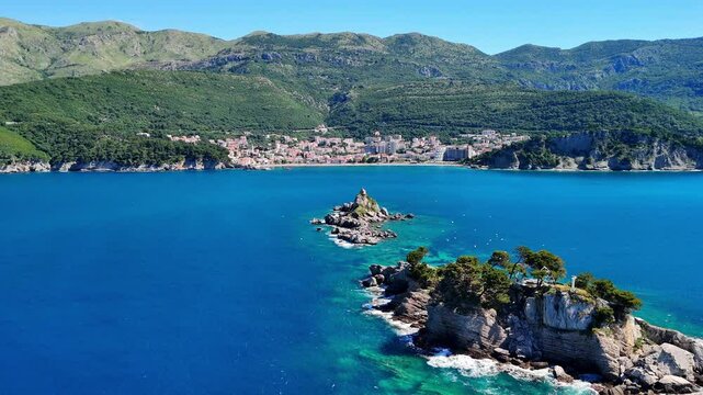 Aerial drone view of the Sveta Nedelja church in Montenegro. A Christian church on a tiny rocky island in the sea near the town of Petrovac.