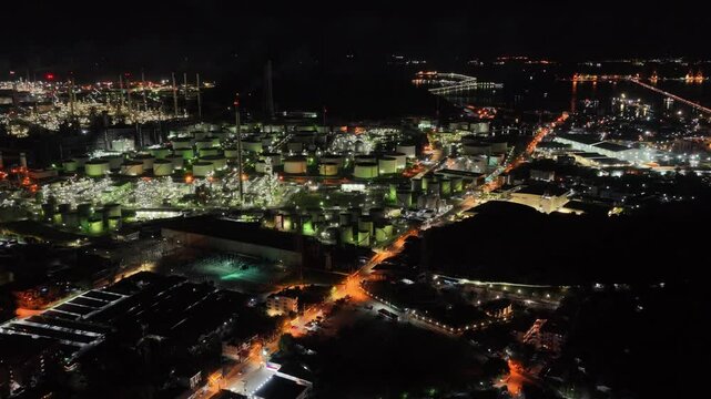 Aerial view footage B roll light oil terminal is industrial facility for storage of oil and petrochemical. oil manufacturing products. power electric plant, low light. Footage b roll drone shot.
