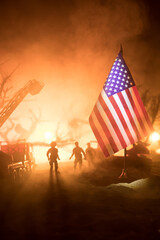 A tabletop diorama of a tragic California wildfire, set in Pacific Palisades near Malibu. Dramatic flames and smoke rise as firefighters battle the blaze