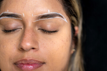 Fototapeta premium Beautician preparing eyebrows for lamination treatment
