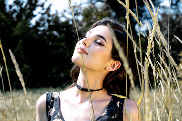 Brunette female 19 years old posing outdoor as fashion model