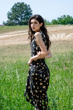 Brunette female 19 years old posing outdoor as fashion model