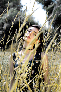 Brunette female 19 years old posing outdoor as fashion model
