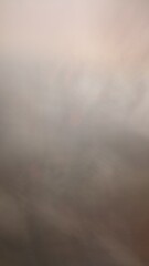 The image is quite blurry and lacks distinct elements, making it difficult to describe in detail. It appears to have muted colors that blend together, creating an abstract and indistinct composition.
