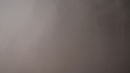 The image is quite blurry and lacks distinct elements, making it difficult to describe in detail. It appears to have muted colors that blend together, creating an abstract and indistinct composition.