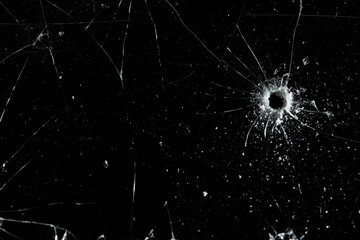 Obraz na płótnie Canvas Bullet holes on black glass, overlay design background