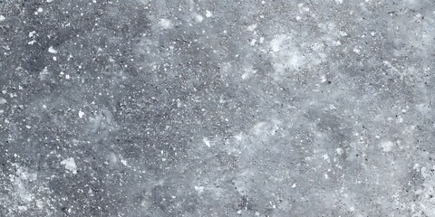 Detailed view of a gray surface with speckles of white and black