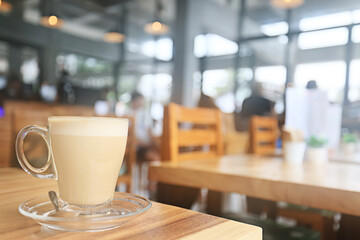 cappuccino, coffee in a clear glass cup in a cafe, soft color background food and drink, hot drink