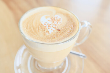 cappuccino, coffee in a clear glass cup in a cafe, soft color background food and drink, hot drink