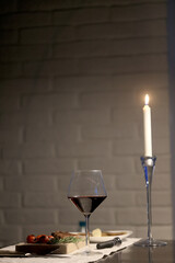 dinner in a restaurant with wine, beautiful table setting, a glass of wine in the foreground
