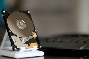 computer hard disk in close-up, disassembled, view inside, computer memory disk
