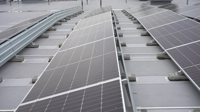 Many solar panels installed on the roof of the building.