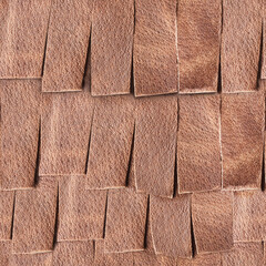 Seamless 4k photo texture material of light brown leather fringe armor surface.