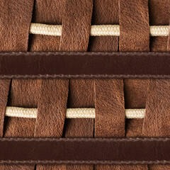 Seamless 4k photo texture material of brown leather pattern with rope insert and straps.
