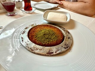 Middle eastern sweets kunefe kunafa kadayif with pistachio Turkish arabic traditional dessert