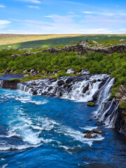 Barnafoss and Hraunfossar showcase stunning waterfalls where glacial waters tumble over unique lava...