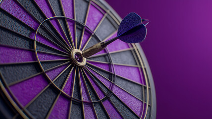 Blue dart hitting the bullseye of a purple dartboard, aiming for success