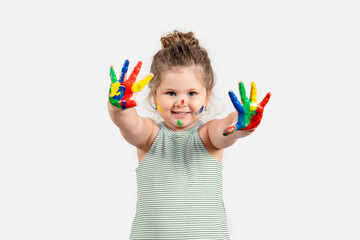 Adorable little girl with painted hands on white background.