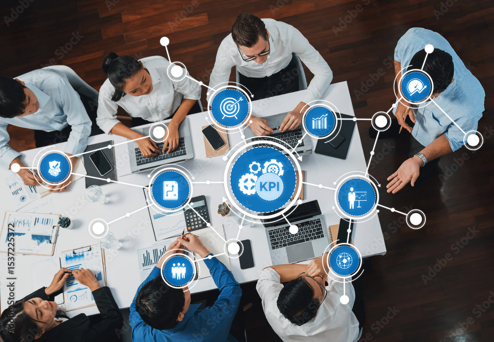 Poster Top view analyst team utilizing BI Fintech to analyze financial data at table in meeting room. Analytic BI dashboard power on paper for business insight and strategic marketing planning. Prudent Amity