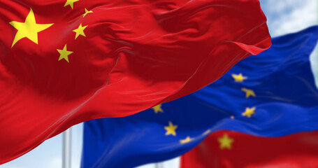 China and European Union flags waving. International relations concept.
