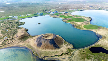 Breathtaking aerial view of Myvatn craters showcasing unique volcanic formations and serene blue...
