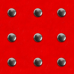 Seamless 4k photo texture material of red leather surface with metal rivet pattern.