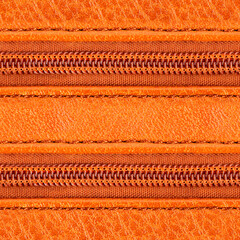 Seamless 4k photo texture material of orange toned leather surface with plastic zippers.