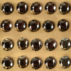 Seamless 4k photo texture material of golden colored leather surface with metal studs.