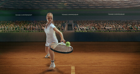 Woman tennis player playing tennis in professional tennis stadium.
