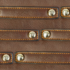 Seamless 4k photo texture material of brown leather surface with riveted straps.