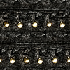 Seamless 4k photo texture material of black leather straps with braiding and metal rivets.