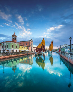 Cesenatico canal, historic sailboats and church. Romagna, Italy