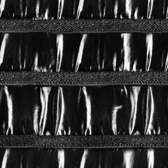 Seamless 4k photo texture material of patent black leather surface with cloth srtraps.