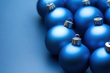 Blue Christmas Ornaments on Blue Background - Holiday Decoration Theme.