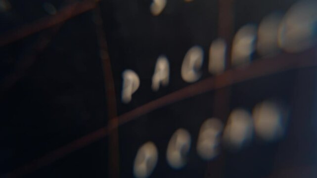 Pacific ocean designation globe blurred macro view. White geographical name 