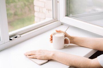 Woman enjoying a peaceful moment with coffee. High quality photo