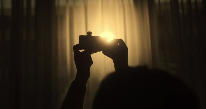 Close Up Hands of Woman Connecting Jigsaw Puzzle With Sunlight Affect. Business Solutions, Success Strategy. Two Hands Connect Couple Puzzle. One Part of Whole Symbol of Association and Connection.