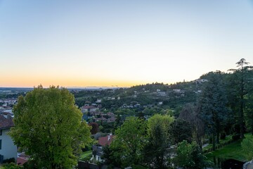 Scenic hillside town at sunset.