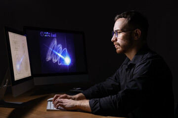 Engineer working with digital drawing at table in office