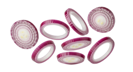 Slices of red onion floating in the air with a plain setting for a food photography shot on transparent background