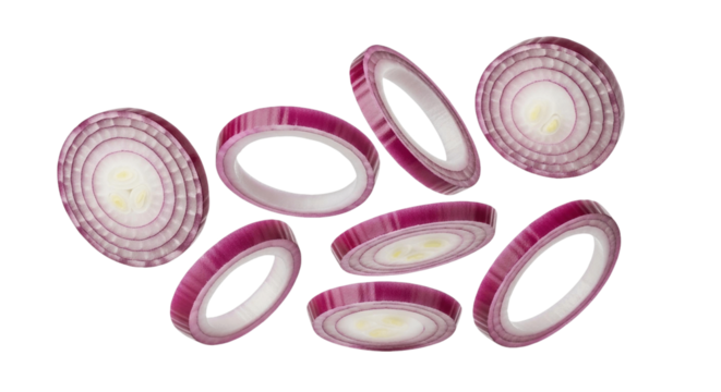 Slices of red onion floating in the air with a plain setting for a food photography shot on transparent background
