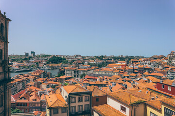 Fototapeta premium panoramic view of orange roofs with colorful houses in the city of porto portugal