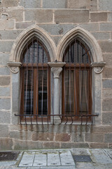 Paired Gothic windows with grilles from the Monroy Palace in Plasencia, C&aacute;ceres province, Spain.