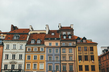 old colorful houses in main old square facades in warsaw