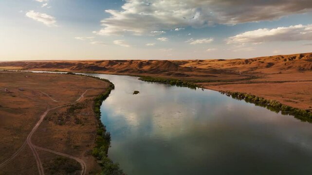 Drone shot of river Ili and spring steppe in Kazakhstan