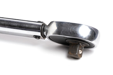 Torque wrench in closeup on white background. Measuring device.