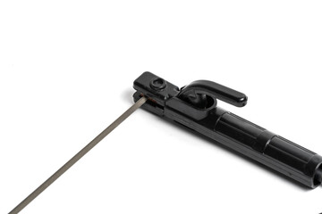 Closeup black welding electrode clamp on white background.