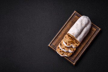 Christmas Stollen, a German sweet cake with marzipan and fruit. Winter Christmas Stollen